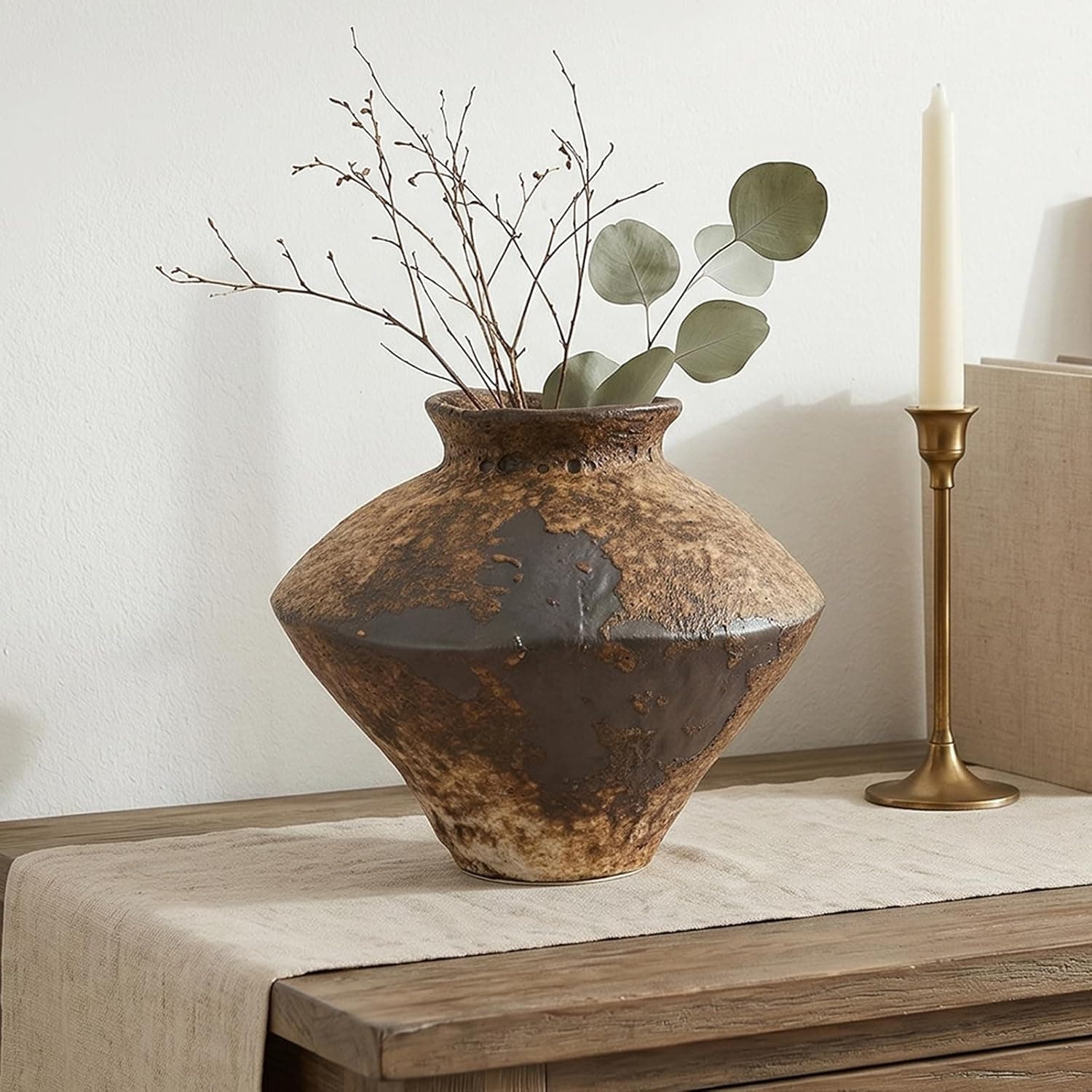 Small round terracotta-style stone vase with an antique-pottery finish