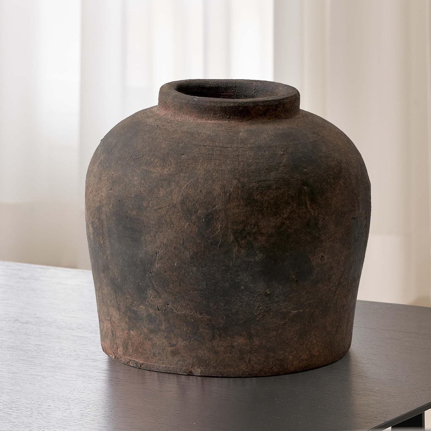 Tall brown ceramic vase with a Zen-style terra cotta pitcher silhouette