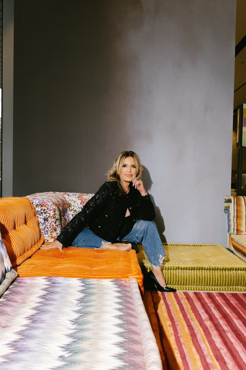 Giselle Koy seated on the Mah Jong sofa
