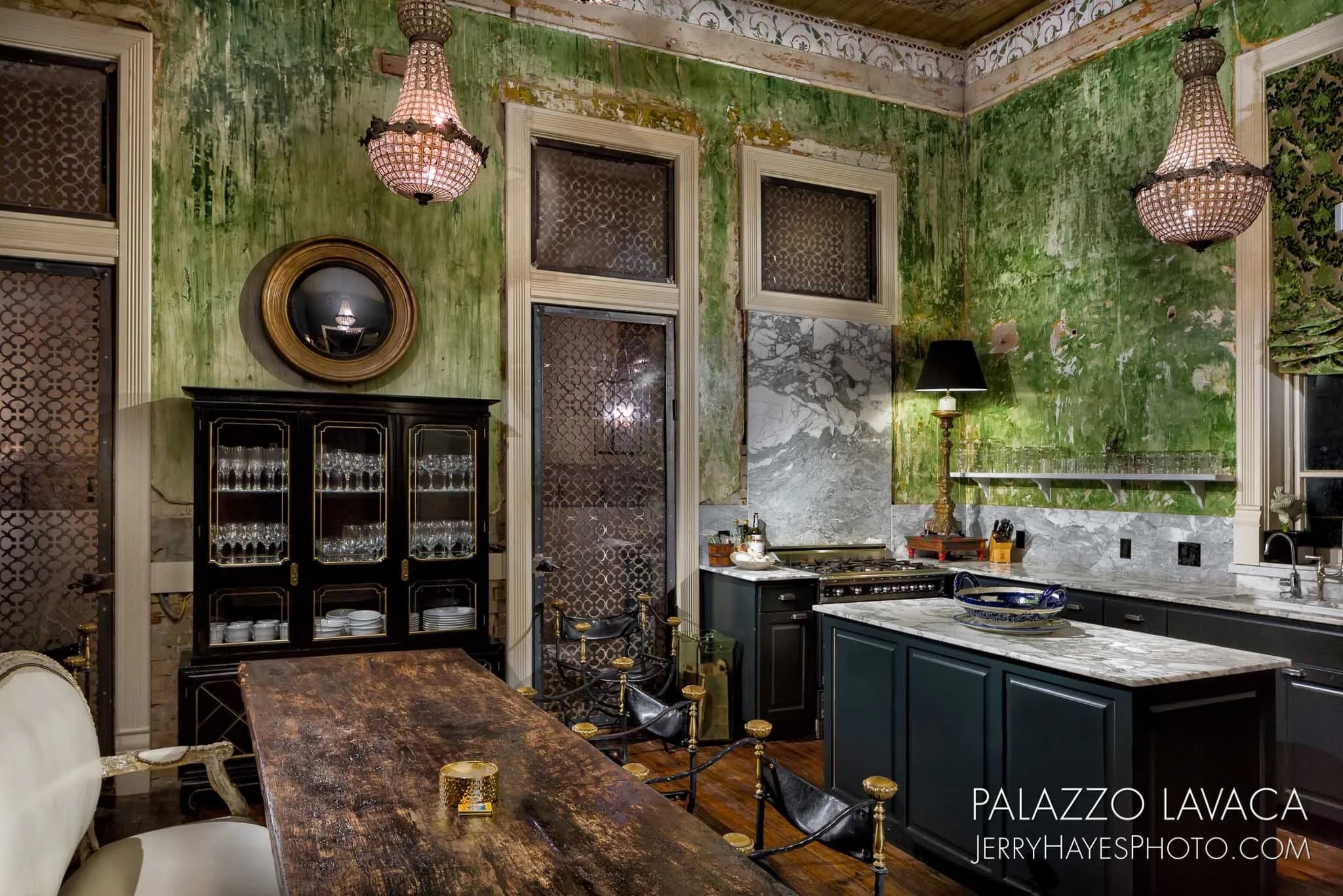 Palazzo Lavaca interior showing the original distressed green plaster walls
