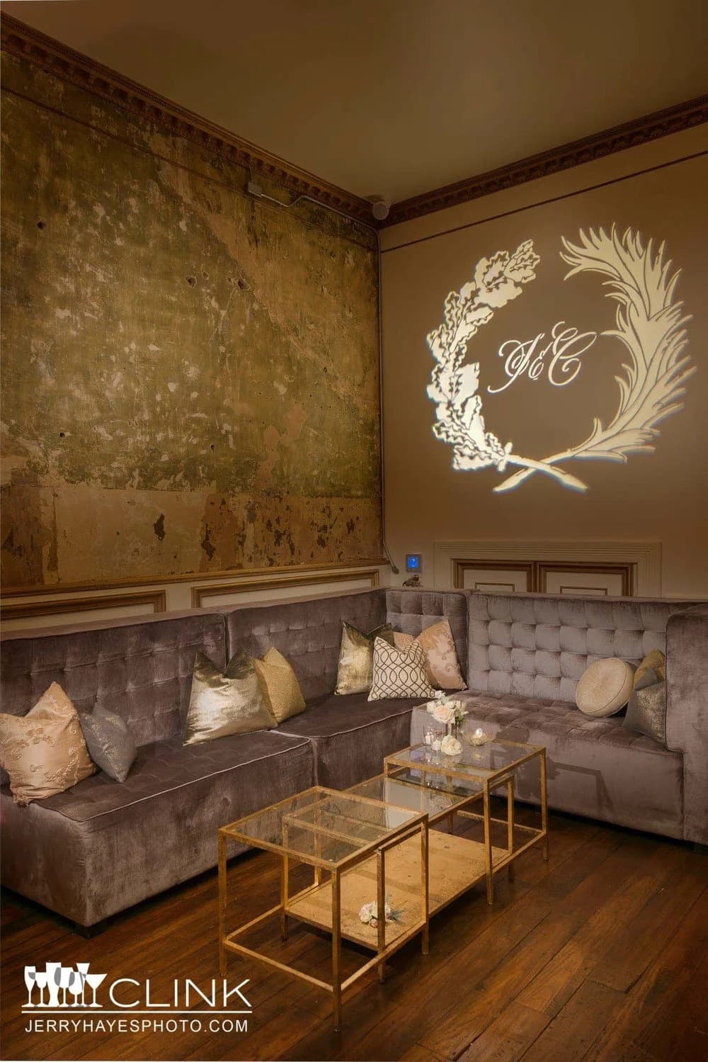 Velvet sofas and a gold-framed glass coffee table — the vintage register of pieces sold through the Chairish shop