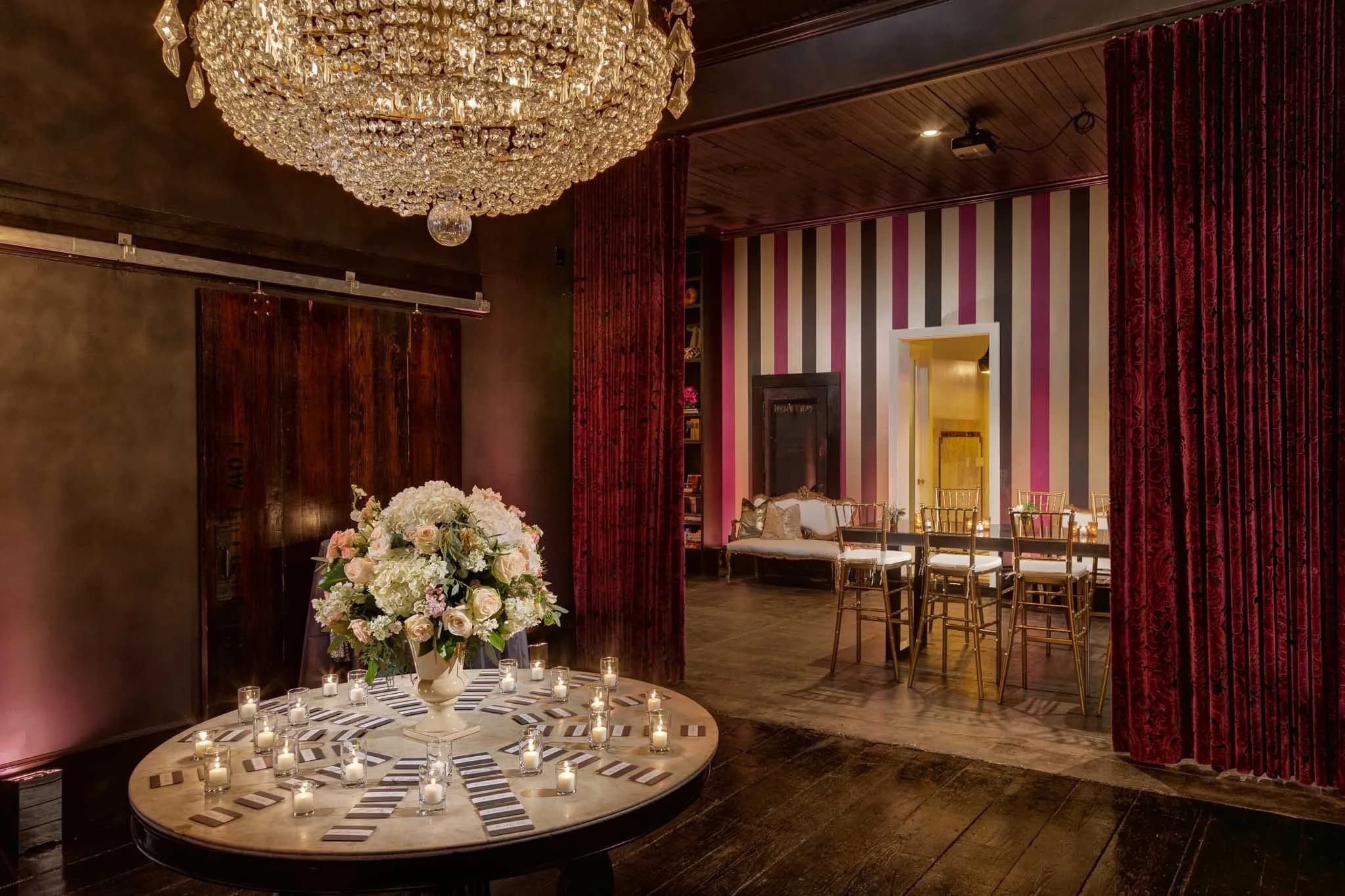 Crystal chandelier casting prismatic light across an ornate ceiling